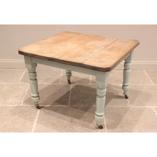 787 - A late Victorian painted scrub top kitchen table, the rectangular top with canted corners, raised up... 