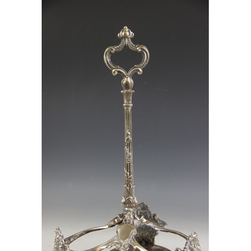 28 - A Victorian three bottle decanter stand, late 19th century, the trefoil base raised on scroll and ac... 