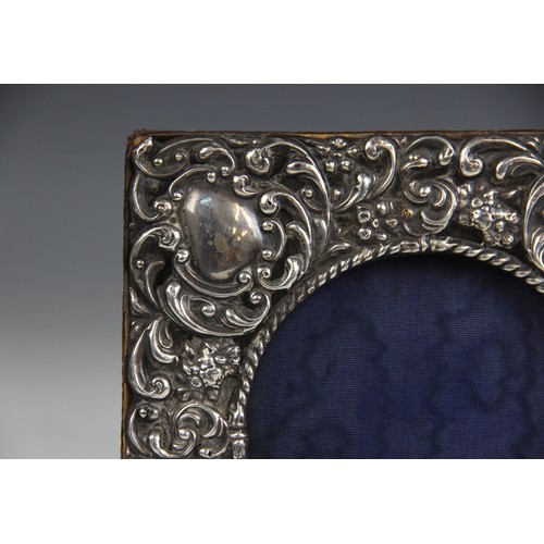 44 - An Edwardian silver mounted photograph frame, W J Myatt & Co, Birmingham 1903, of square form emboss... 