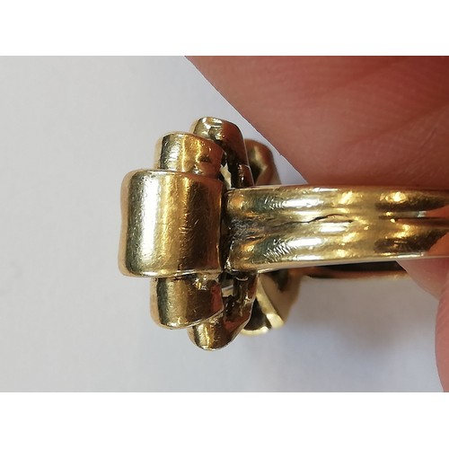 156 - A continental 18ct gold ring, the head modelled in yellow and white gold, 17.6mm x 12.2mm, set to 18... 