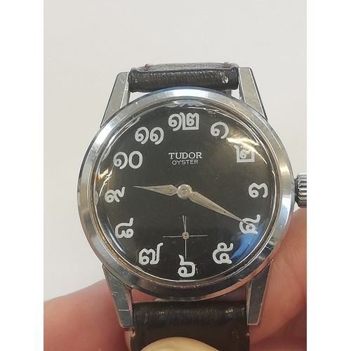 74 - A Tudor Oyster wristwatch, the circular black dial with Thai numerals and subsidiary seconds dial to... 