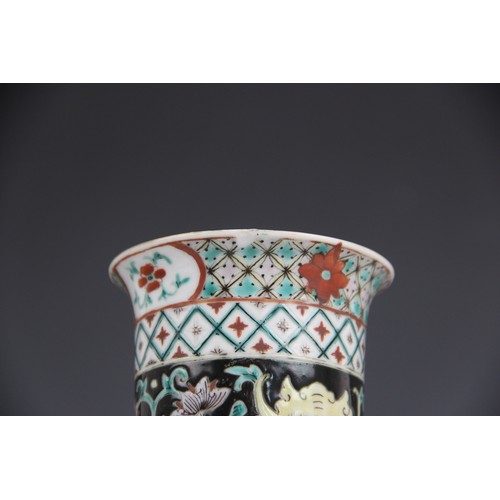 423 - A Chinese porcelain famille noir sleeve vase, 19th/20th century, of typical cylindrical form and dec... 