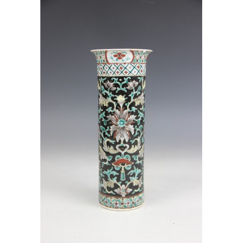 423 - A Chinese porcelain famille noir sleeve vase, 19th/20th century, of typical cylindrical form and dec... 