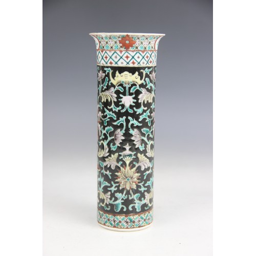 423 - A Chinese porcelain famille noir sleeve vase, 19th/20th century, of typical cylindrical form and dec... 