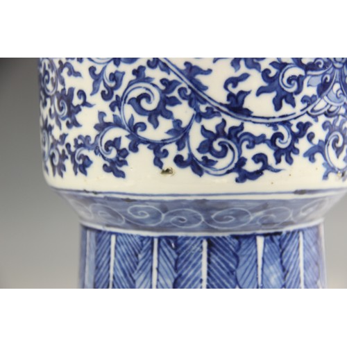 412 - A large Chinese porcelain blue and white Gu vase, 18th/19th century, decorated with formal scrolling... 