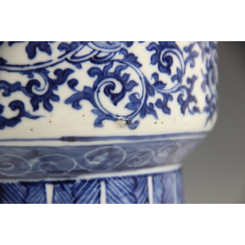 412 - A large Chinese porcelain blue and white Gu vase, 18th/19th century, decorated with formal scrolling... 