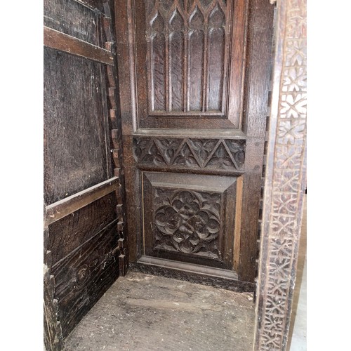 792 - A substantial 19th century carved oak sideboard back, profusely carved with flowerhead and geometric... 