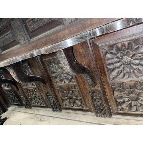 792 - A substantial 19th century carved oak sideboard back, profusely carved with flowerhead and geometric... 