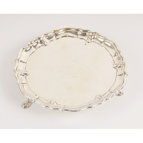 110 - A George II silver waiter, John Tuite, London 1735, of circular form with pie crust border on three ... 