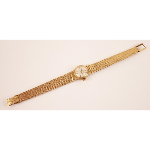 119 - A lady's Omega 9ct gold wristwatch, the round pearlescent dial with baton markers, set to a circular... 