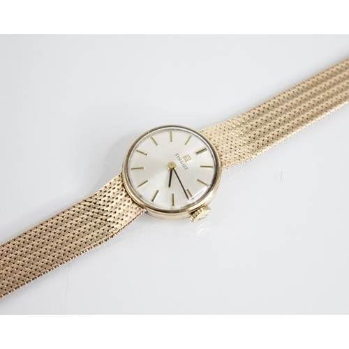 134 - A lady’s vintage 9ct gold Tissot wristwatch, round pearlescent dial with baton markers, set to a pla... 