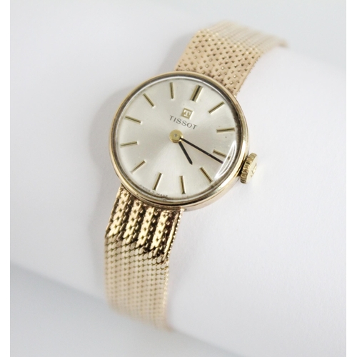 134 - A lady’s vintage 9ct gold Tissot wristwatch, round pearlescent dial with baton markers, set to a pla... 