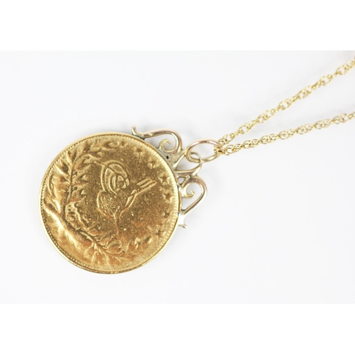 145 - A Turkish 100 Kurush coin, 23mm diameter, upon a gold coloured pendant mount, upon a fine 9ct gold c... 