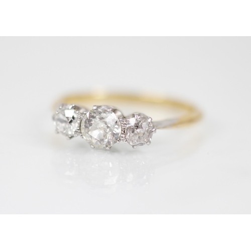 148 - A diamond three-stone ring, the central circular old cut diamond measuring approximately 5.2mm x 3mm... 