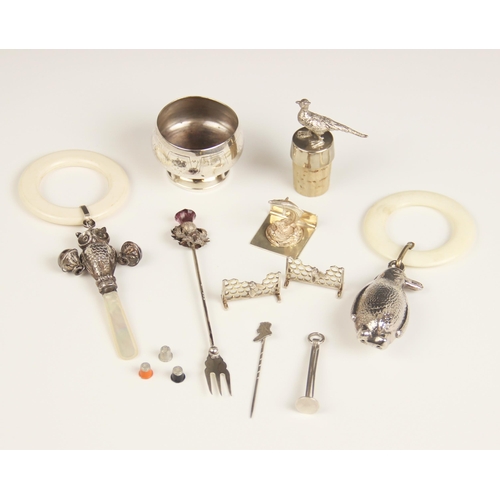 22 - A selection of silver and silver coloured accessories, to include a novelty silver rattle, Crisford ... 