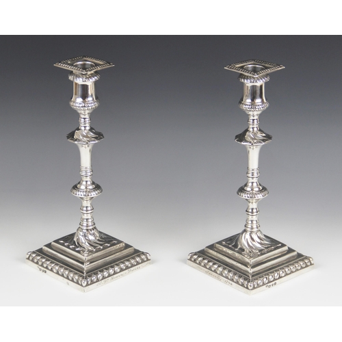 56 - A pair of George III silver candlesticks, hallmarked I.W (possibly John Weldring or James Wibird), L... 
