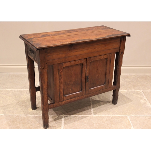 784 - A Victorian pitch pine ecclesiastical side cabinet, the rectangular moulded top above a pair of oppo... 