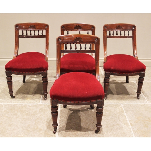 790 - A set of seven Victorian oak and red velour dining chairs, each with a shaped top rail above a padde... 