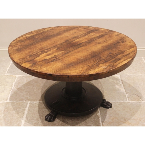 791 - A mid 19th century rosewood breakfast/centre table, the circular top raised upon a tapering octagona... 