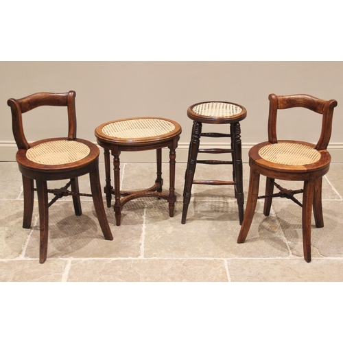 792 - A pair of 19th century elm and rattan stools, each with a shaped compact rail back rest above a circ... 