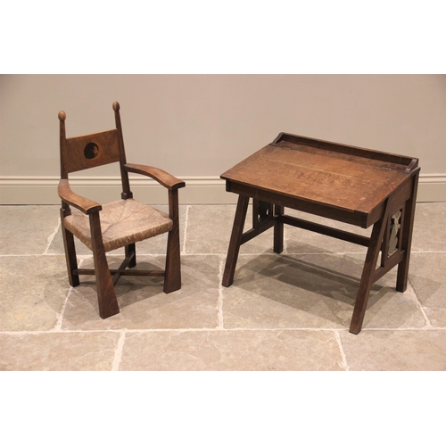 812 - An Arts and Crafts child's oak chair, in the manner of William Birch for Liberty & Co, early 20th ce... 