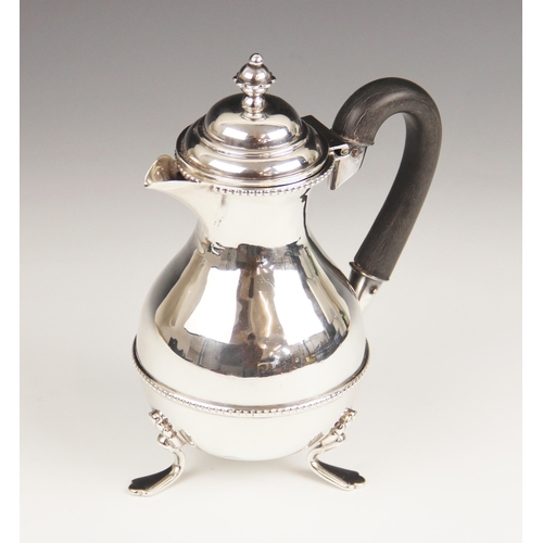 58 - A Victorian silver chocolate pot, William Devenport, Birmingham 1897, of baluster form with beaded b... 