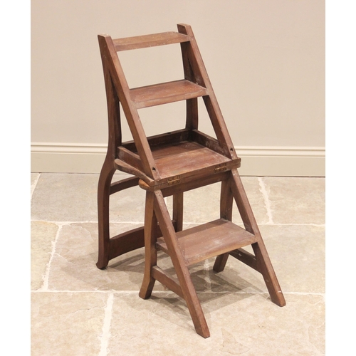 770 - A metamorphic hardwood library steps/chair, the rail back chair with hinged seat converting into a s... 