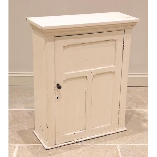 777 - A painted wall cabinet, late 19th /early 20th century, the moulded cornice above a single panelled d... 