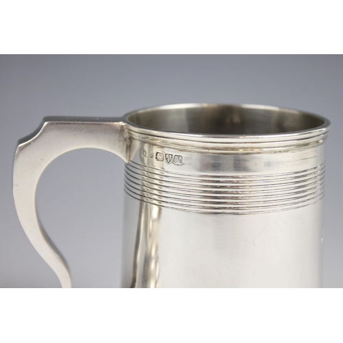 24 - A George V silver christening mug, Stokes & Ireland Ltd, Chester 1921, of tapering cylindrical form ... 