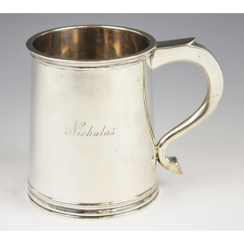 25 - A George IV silver tankard, Adie Brothers, Birmingham 1948, of tapering cylindrical form of raised b... 