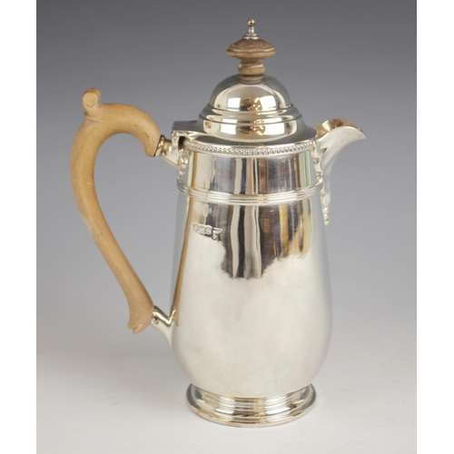 79 - A George V silver hot water jug, Walker & Hall, Sheffield 1915, of tapered cylindrical form with ban... 