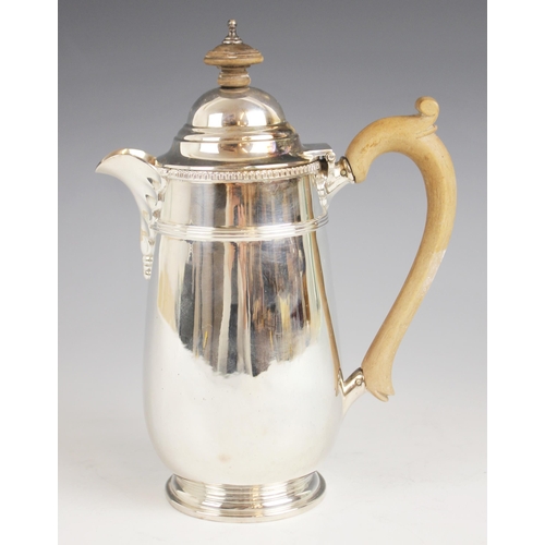 79 - A George V silver hot water jug, Walker & Hall, Sheffield 1915, of tapered cylindrical form with ban... 