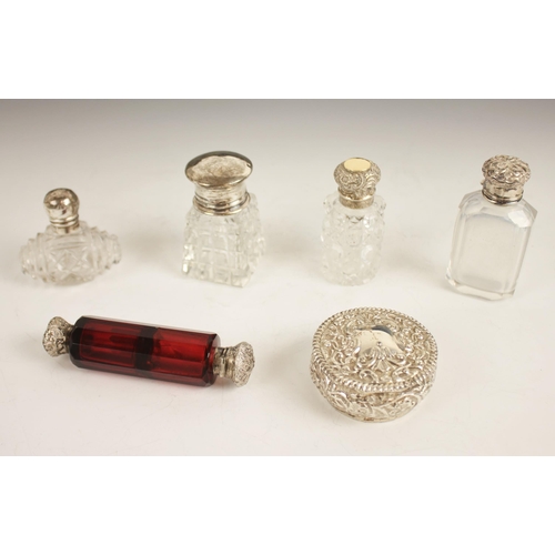 88 - A selection of silver and cut glass dressing table bottles, to include a late Victorian silver pill ... 