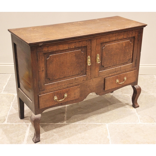 762 - An 18th century and later reconstructed oak sideboard, the later rectangular top above a pair of fie... 