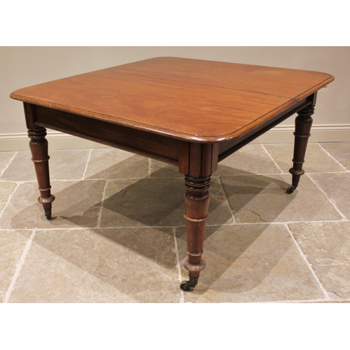 758 - A Victorian mahogany dining table, the rectangular top with rounded corners and moulded edge, raised... 