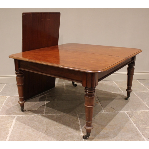 758 - A Victorian mahogany dining table, the rectangular top with rounded corners and moulded edge, raised... 