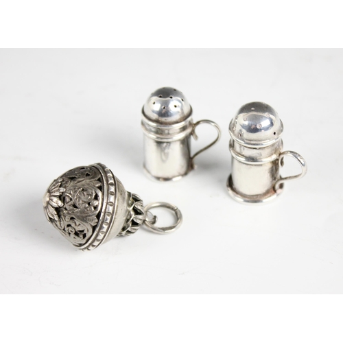 50 - A continental silver coloured pomander pendant, of acorn form, with bottom section with pierced scro... 