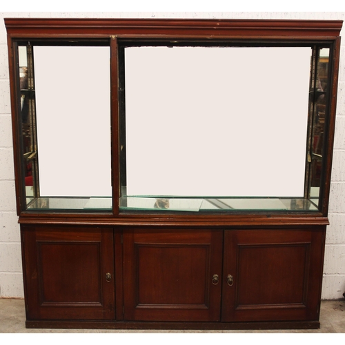 756 - A late 19th/early 20th century and later stained wood museum display cabinet, the moulded cornice ab... 