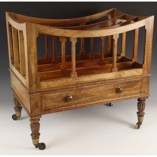 797 - A Regency mahogany canterbury, with three divisions above a frieze drawer and raised on four reeded ... 