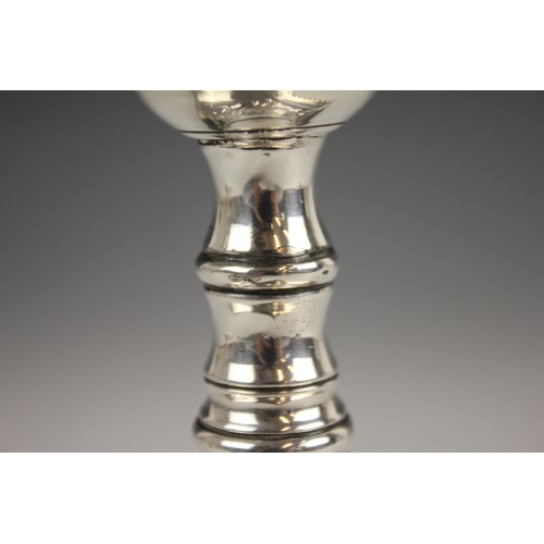 56 - A pair of George III silver candlesticks, hallmarked I.W (possibly John Weldring or James Wibird), L... 