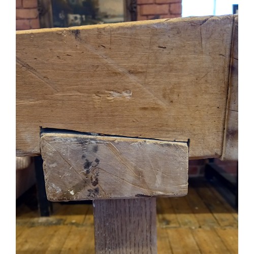 751 - A sycamore butchers block, late 19th/early 20th century, of gnarled and worn rectangular form, raise... 