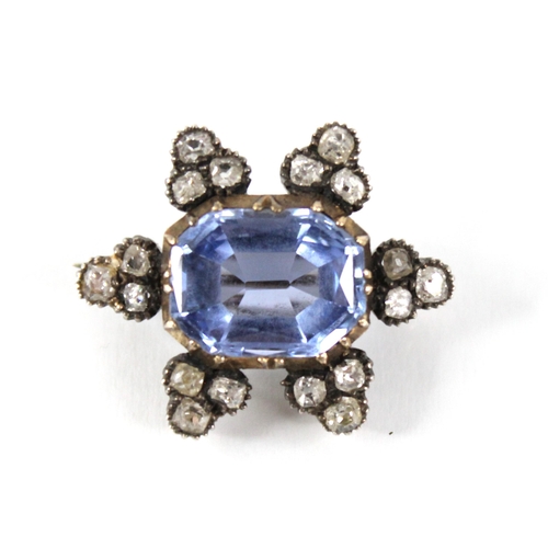 101 - A Victorian sapphire and diamond cluster brooch, the central rectangular mixed cut sapphire with can... 