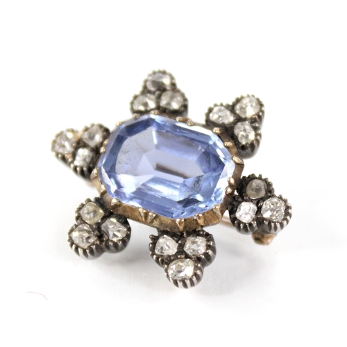 101 - A Victorian sapphire and diamond cluster brooch, the central rectangular mixed cut sapphire with can... 