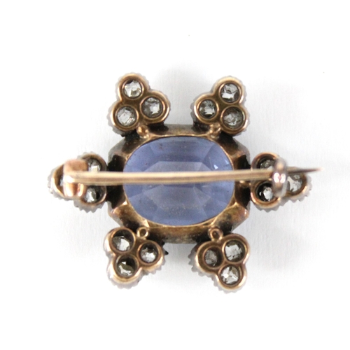 101 - A Victorian sapphire and diamond cluster brooch, the central rectangular mixed cut sapphire with can... 