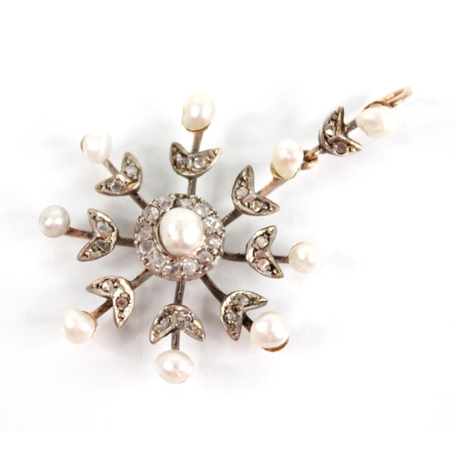 103 - An Edwardian pearl and diamond snowflake pendant, designed as a central off-round pearl with a borde... 