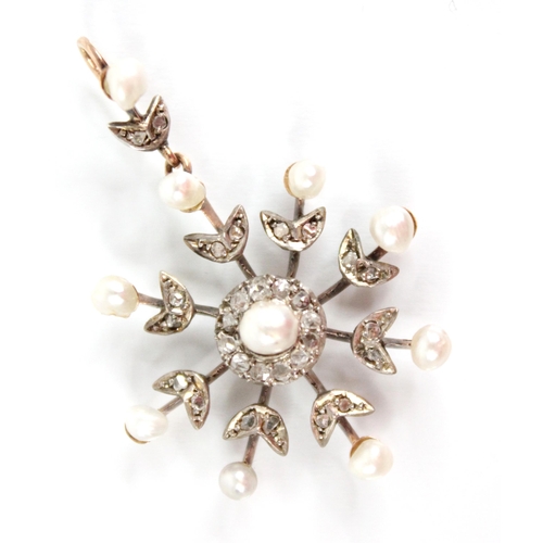 103 - An Edwardian pearl and diamond snowflake pendant, designed as a central off-round pearl with a borde... 