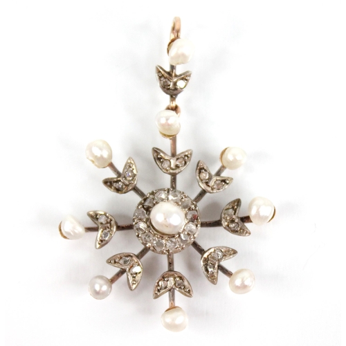 103 - An Edwardian pearl and diamond snowflake pendant, designed as a central off-round pearl with a borde... 