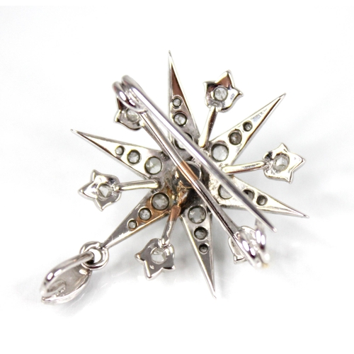 107 - A diamond starburst pendant brooch, the tiered six pointed star set throughout with rose cut diamond... 