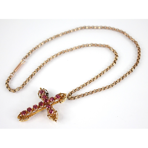 110 - A ruby set gold coloured cross pendant, 45mm x 35mm, upon a Victorian 9ct gold belcher link chain, 4... 