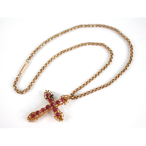 110 - A ruby set gold coloured cross pendant, 45mm x 35mm, upon a Victorian 9ct gold belcher link chain, 4... 